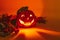 Ceramic candlestick in the shape of a Halloween pumpkin glows in the dark