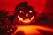 Ceramic candlestick in the shape of a Halloween pumpkin glows in the dark