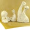 Ceramic cats and dogs, figurines standing on a napkin