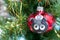 The ceramic Christmas decoration cute ladybird on the branch of Christmas tree