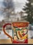 Ceramic color cup with animals collage and snowy background