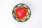 ceramic decorated food bowl with three dimension 3d red hart symbol inside on white background copy text space top view