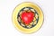 ceramic decorated food bowl yellow plate with three dimension 3d red hart symbol inside on white background copy text space top