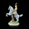 Ceramic figurine of a male commander on a horse on a black background.