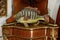 Ceramic fish figurine on a vintage shelf