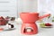 Ceramic fondue pot with candle