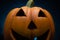 Ceramic Halloween pumpkin. Trick or treat scary spooky grinning Jack-o\'-lantern face decoration.
