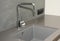 Ceramic kitchen sink. Modern kitchen metal faucet and ceramic kitchen sink.