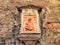 Ceramic Madonna and Child Icon on Historic Siena Building, Tuscany, Italy