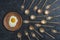 Ceramic plate with fried egg and brass forks and spoons look like sperm competition. Spermatozoons floating to ovule