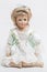 Ceramic porcelain handmade blond doll in white and green dress