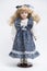 Ceramic porcelain handmade doll with long blond hair and blue dress