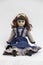 Ceramic porcelain handmade doll with long brown hair and blue dress