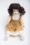 Ceramic porcelain handmade doll with long brunette hair and beige dress