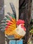 Ceramic rooster in the small alleyways of Bangkok old district Talat Noi.