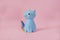 Ceramic souvenir toy moneybox kitten Korn blue with colorful rainbow tail with closed eyes and unicorn horn on pink