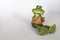 Ceramic statue of cheerful Frog with flower