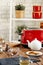 Ceramic teapot and toaster, kitchen table close up