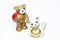 Ceramic teddy bears with gifts and a heart