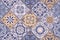 Ceramic tile pattern, mosaic decor. Floral print for wall in vintage portuguese patchwork style, blue floor background