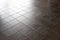 Ceramic tile surface, floor, dark stone pattern.