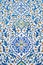 ceramic tile with a traditional Uzbek floral ornament with a pattern. Wall of white mosque Minor in Tashkent in