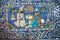 Ceramic tiles of 19th century with a lion & two persian men talking in garden