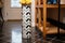 a ceramic umbrella stand in a tiled mudroom