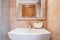 Ceramic washbasin in beige toilet
