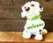 Ceramic welcome dog on wooden background