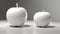 Ceramic white apples on a light background.