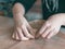 Ceramist hands make a plate of brown clay. retro. vintage