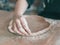 Ceramist hands make a plate of brown clay. retro. vintage