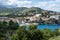 Cerbere france scenic coastal town dappled in sunlight. Sunlit mountains behind.