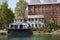 Cerea Rowing Club building and terrace with people, Po river in Piedmont, Turin, Italy