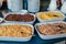 Cereal in big bowls for self service dry quick breakfast food in hotel restaurant selection . Buffet display, catering for brunch