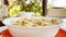 Cereal bowl with milk for breakfast outdoors in summer