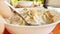 Cereal bowl with milk for breakfast outdoors in summer