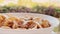 Cereal bowl with milk for breakfast outdoors in summer