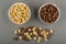 Cereal breakfasts with chocolate and caramel in bowls, cereal rings on gray table. Top view