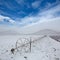 Cereal fields with irrigation wheels with snow in Nevada