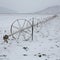 Cereal fields with irrigation wheels with snow in Nevada