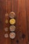 Cereal grains in glass jars on wooden background. Collection of different groats top view barley, oats, millet and wheat