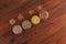 Cereal grains in glass jars on wooden background. Collection of different groats top view barley, oats, millet and wheat