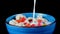 cereal muesli with flakes with fruit and nuts is poured with milk