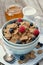 Cereals, berries, honey and milk, close-up