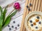 Cereals and berry on wooden box and violet tulip