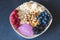 Cereals and fruits superbowl, healthy bowl breakfast with flakes, oat and fruits: raspberries, blueberries, banana, blackberries