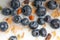 Cereals, granola with blueberries with milk texture closeup, macro