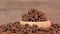 Cereals on plate. Chocolate flakes. Dry chocolate rings rotating in wooden plate.